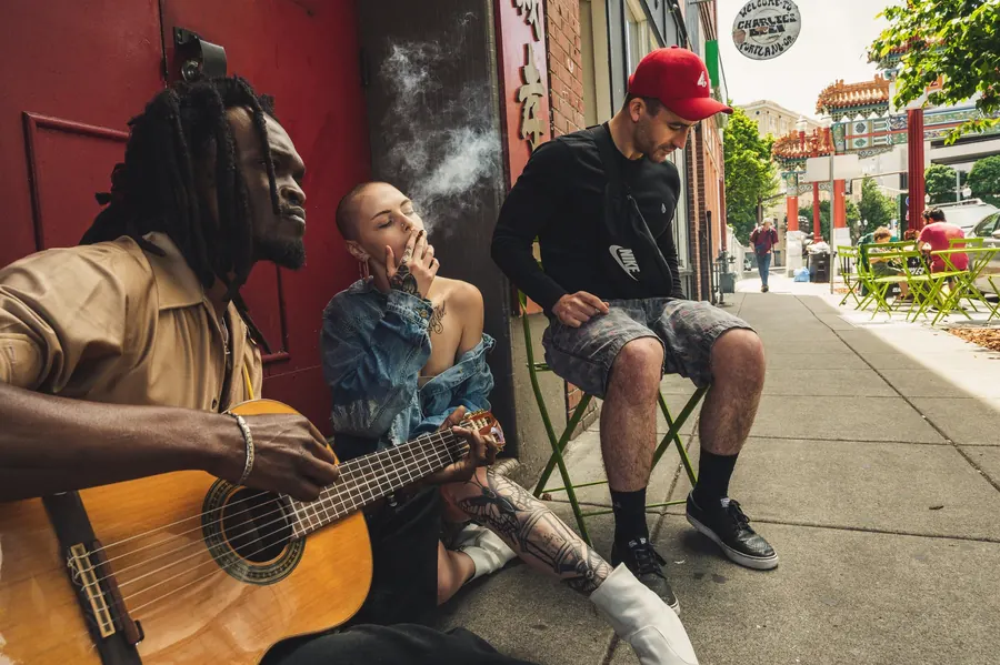 American smoke shop customers on a city sidewalk, the retail demand US distributors serve